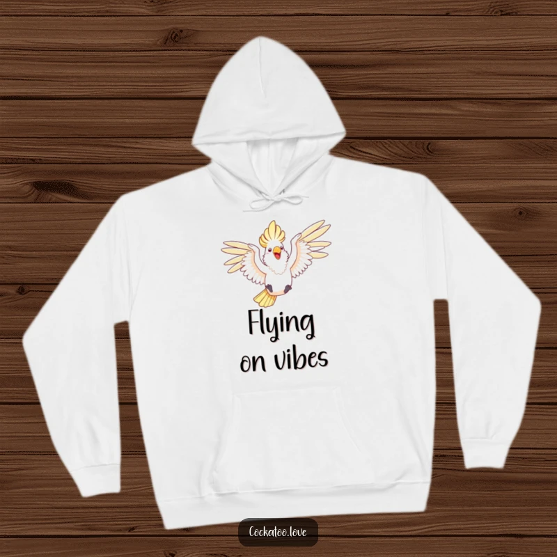Funny hoodie featuring a happy cockatoo with wings outstretched, joyfully leaping through the air.