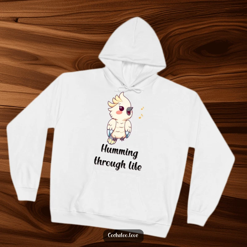 Funny Cockatoo Hoodie: A cockatoo with puffed cheeks joyfully whistles a happy tune, depicted in a funny, musical illustration.