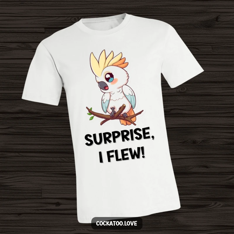 Funny t-shirt with a wide-eyed cockatoo character comically tumbling from a tree branch, expressing surprise.