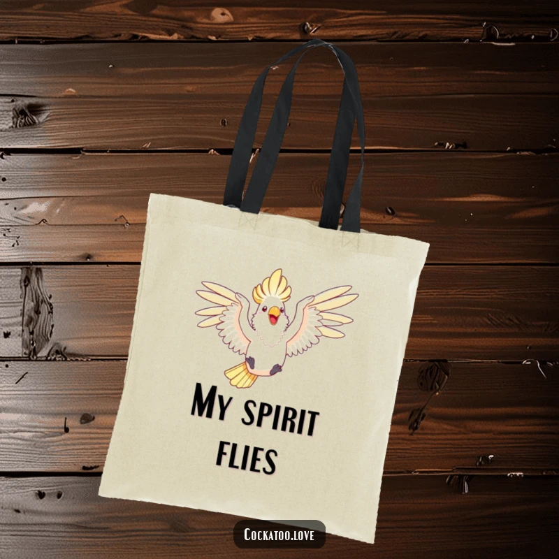 Funny tote bag featuring a happy cockatoo with wings outstretched, joyfully leaping through the air.