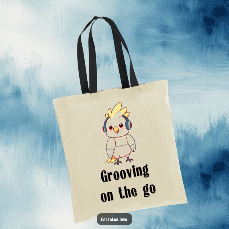 Funny tote bag featuring a cockatoo character wearing headphones and bopping to music, ideal for music-loving bird fans.